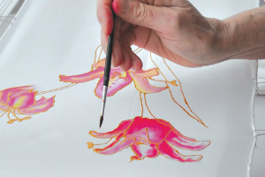 white silk with pink painted flowers